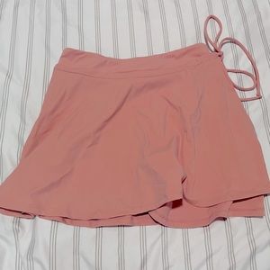 light pink Halara golf skirt.